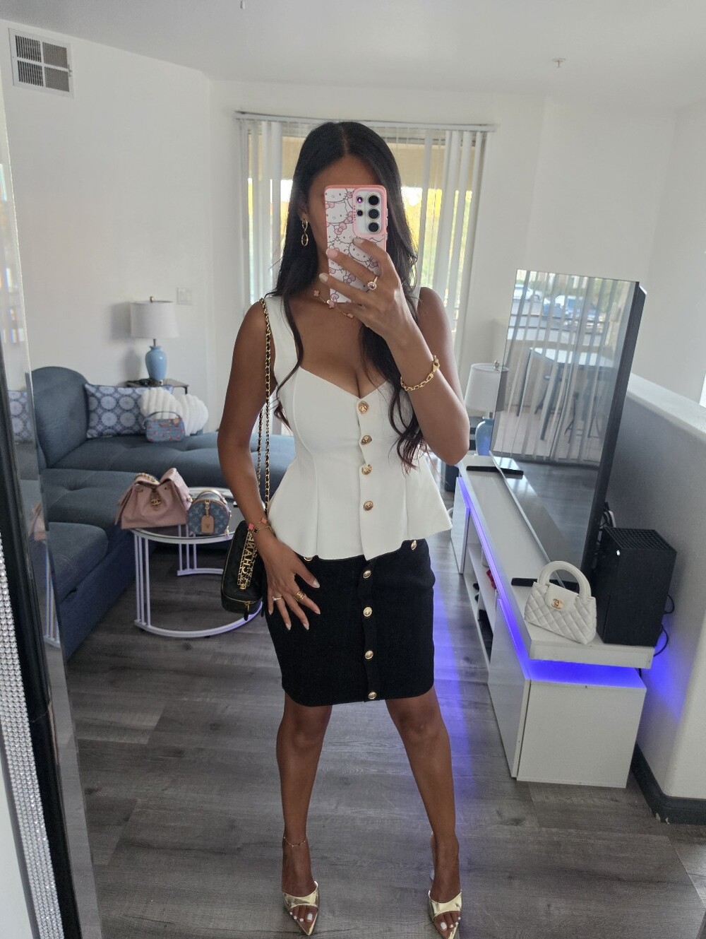 Sleeveless White Peplum Button Front Top